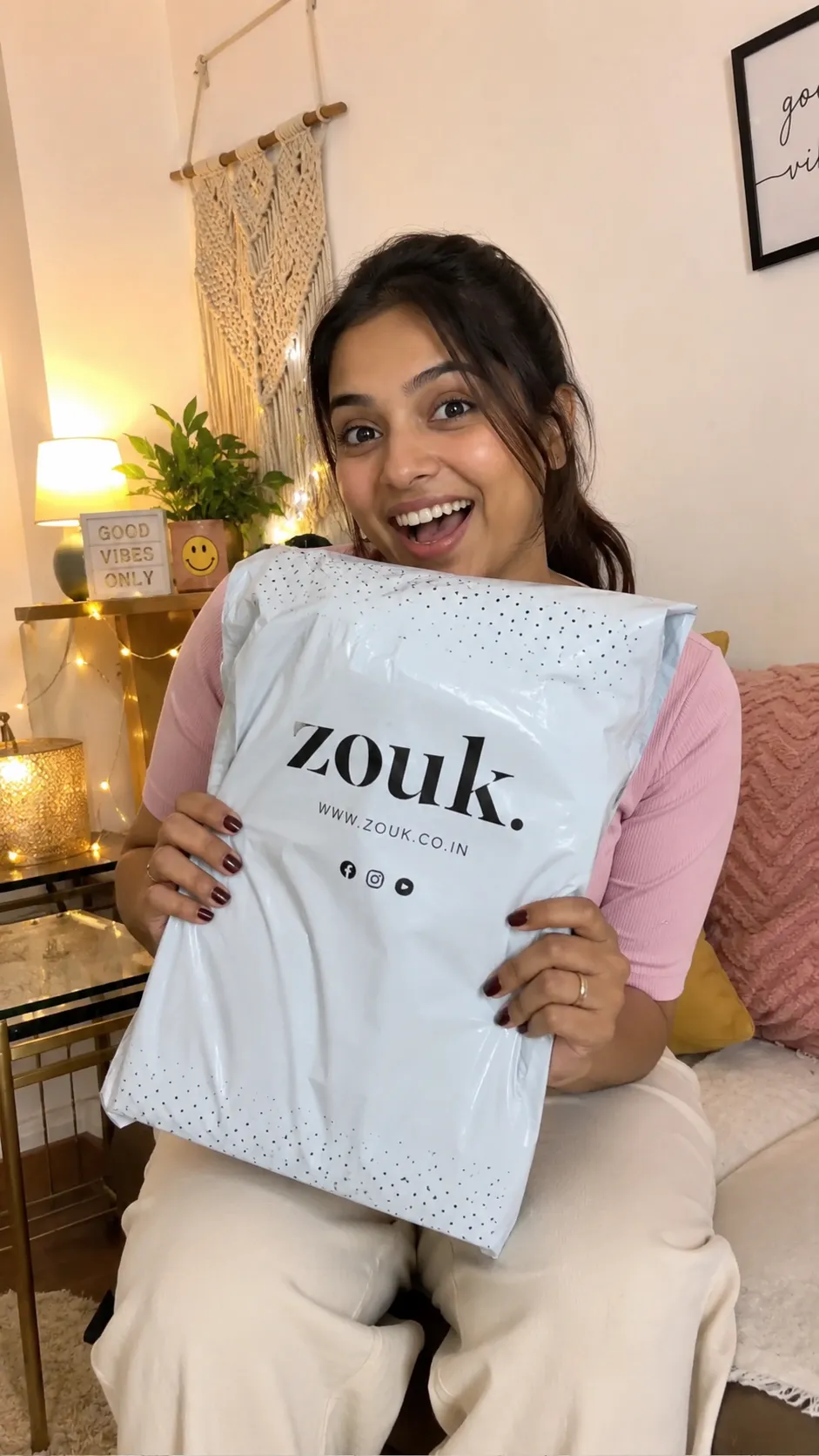 Indian woman unboxing a Zouk fashion delivery